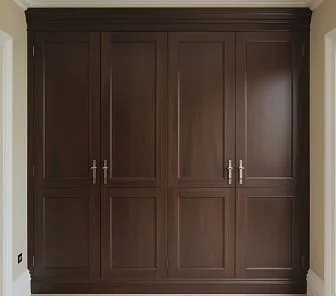 Шкаф из массива тёмного ореха с классическими филёнчатыми фасадами