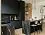 Элитная угловая чёрная кухня с барной стойкой