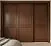 Современный шкаф-купе с 3 глухими дверями из тёплого дерева