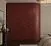 Радиусный шкаф в цвете глубокий бордо с латунными ручками